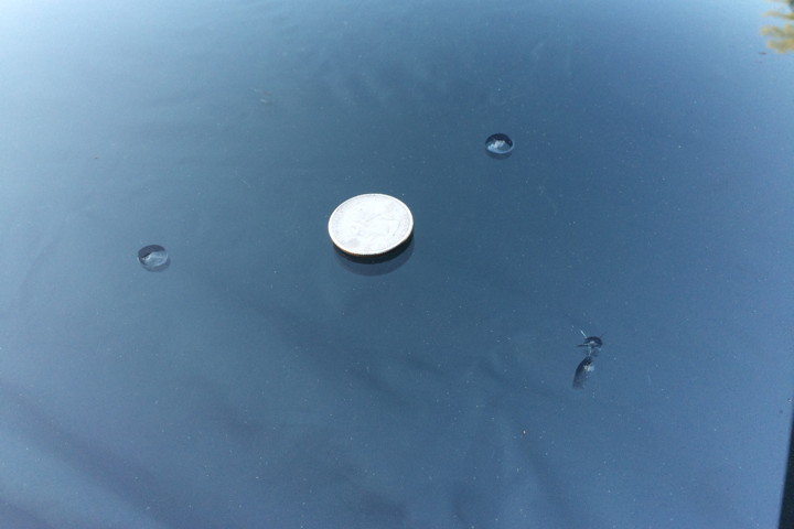 Quarter on a windshield